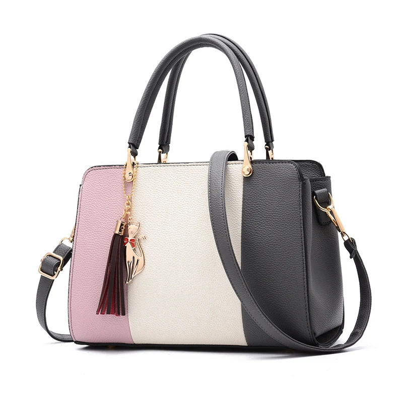 Bolsa de mão com cores contrastantes. Ideal para um visual moderno e elegante, perfeita para diversas ocasiões. Design espaçoso e versátil, essencial no dia a dia. — foto 3