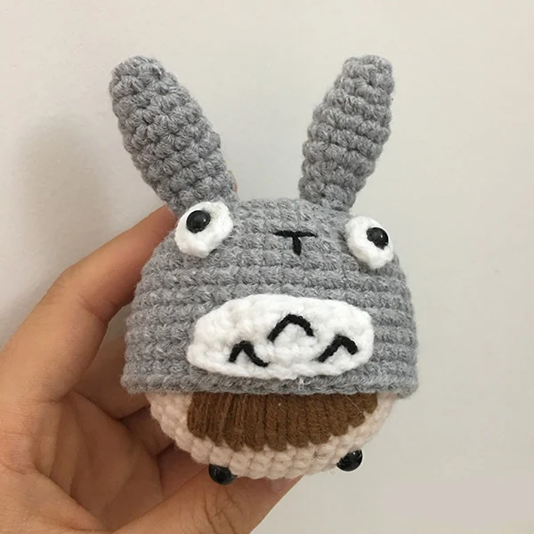 Title 7, Hand-knitted wool doll for cuddles and play, so...