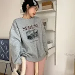Blusa Feminina Estilo Coreano Soltinha e Emagrecedora, perfeita para um visual casual e moderno. Conforto e elegância em uma só peça. — foto 1