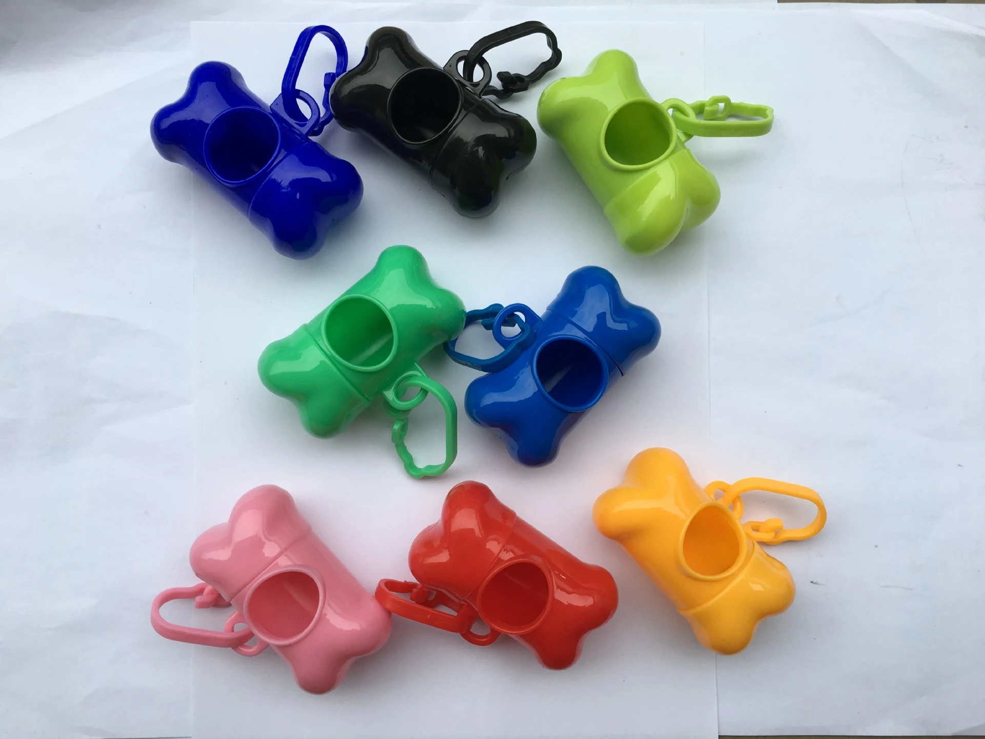 Bone-shaped pet waste bag dispenser, convenient, portable and designed to make picking up after your dog easy on daily w — photo 36