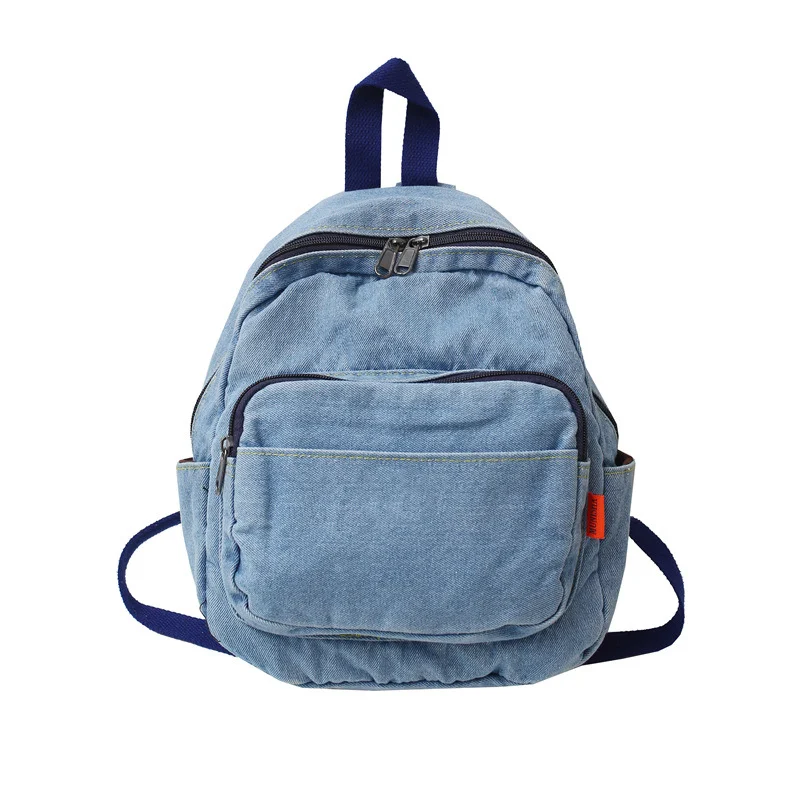 Mochila feminina de lona jeans lavada, perfeita para uso diário e viagens. Confortável, espaçosa e resistente, ideal para transportar seus pertences. — foto 1