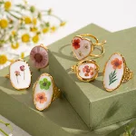 Anel de aço inoxidável com design de flor especial, acessório com abertura para um ajuste perfeito, um toque de elegância. — foto 2