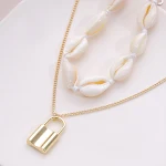 Colar étnico com fecho de concha, um acessório boêmio elegante. Adicione um toque único ao seu estilo, perfeito para looks de verão e presentes especiais. — foto 4