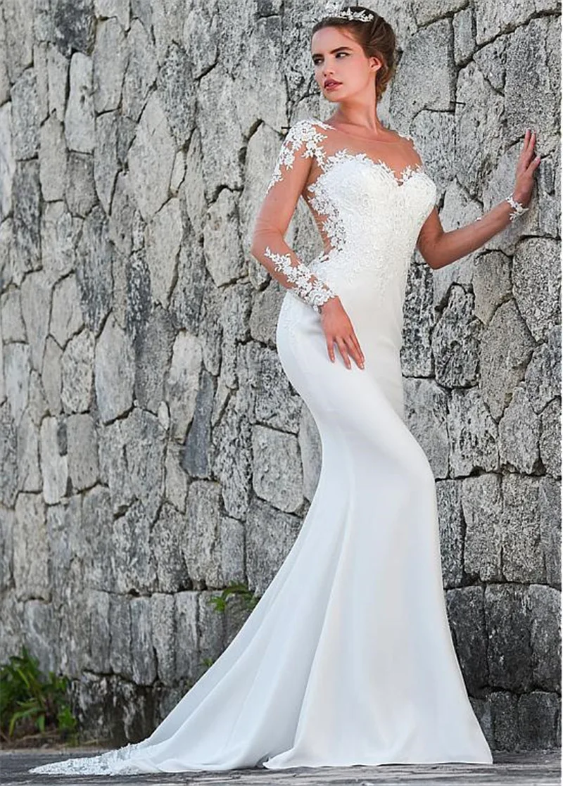 Simple wedding dress with a thin tail, perfect for brides seeking effortless elegance on their special day. A beautiful, — photo 3