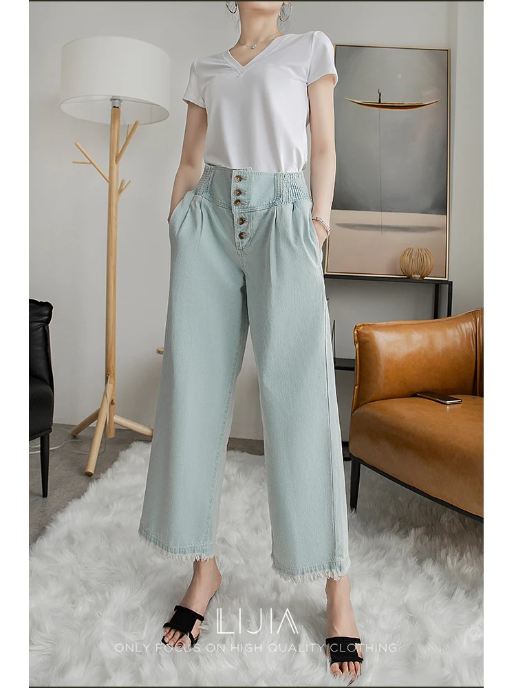 Title 2, Lichtblauwe high-rise jeans met wijde pijpen en...