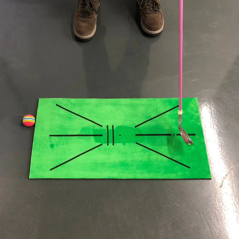 Title 3, Golf practice mat with trajectory marking. See ...