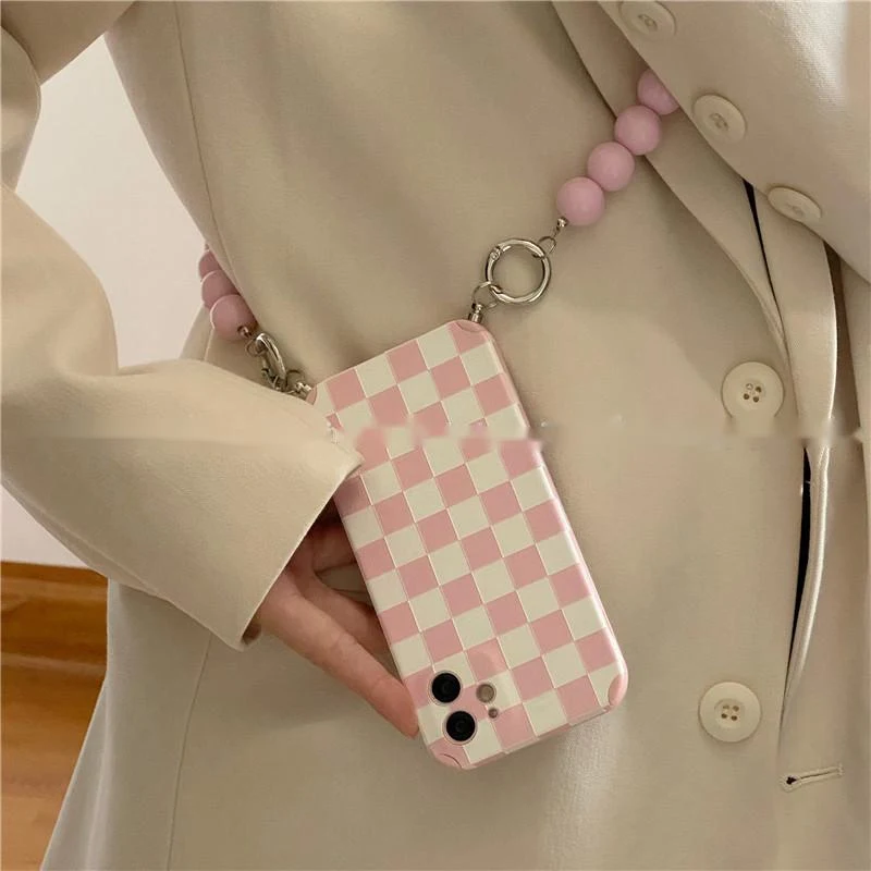 Title 6, Phone case with bead chain diagonally across. C...
