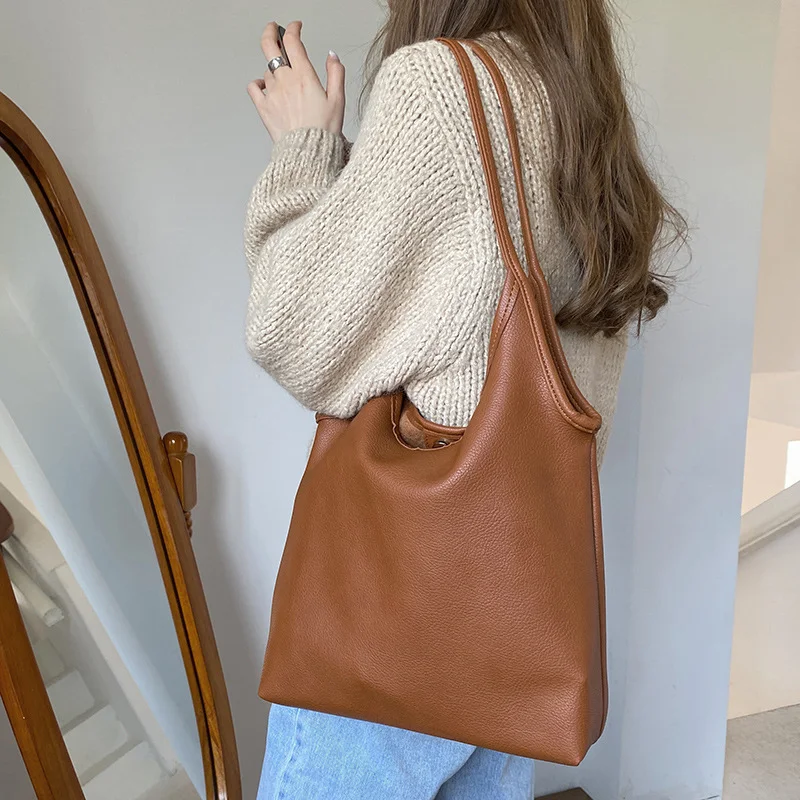 Bolsa de mão de couro PU macio e leve, cor sólida. Perfeita para uso diário, oferece conforto e elegância, ideal para diversas ocasiões. — foto 7