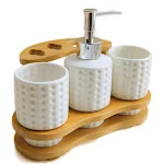 Complete bathroom accessories set with soap dispenser, tumbler, soap dish, and toilet brush, adding style and organizati — photo 3