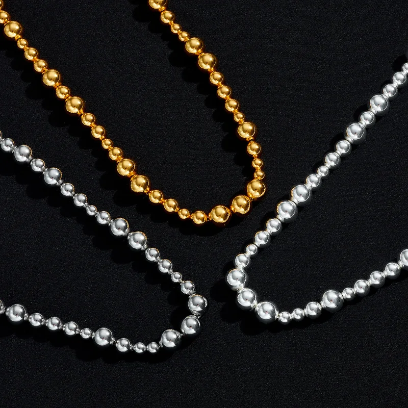 Colar de bolinhas irregulares com banho de cobre e ouro 18K, um acessório elegante e moderno que adiciona um toque sofisticado ao seu visual. — foto 11