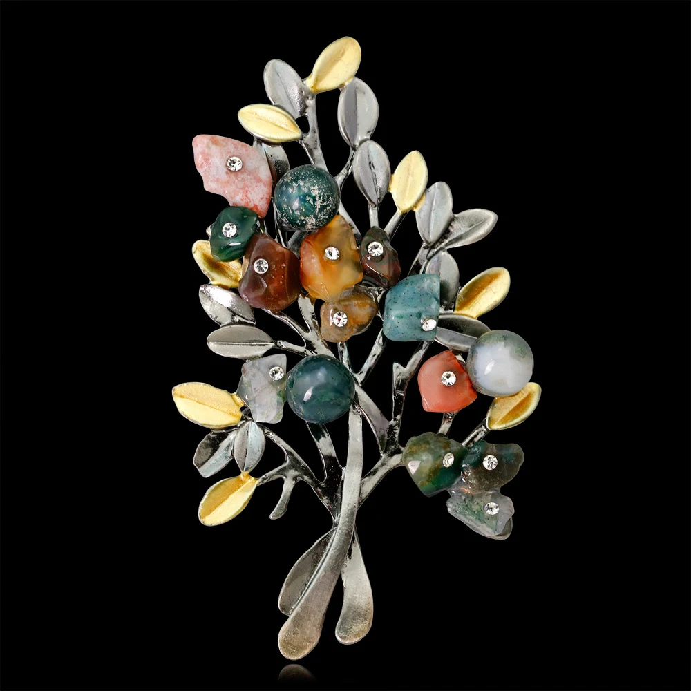 Broche de árvore de Natal com pedras coloridas, um acessório criativo e elegante para celebrar a época festiva com estilo. — foto 1
