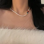 Colar de pérolas com cores contrastantes estilo chinês, vermelho e verde. Adicione um toque de sofisticação e cultura ao seu visual. — foto 7