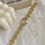 Gold Strap White Surface
