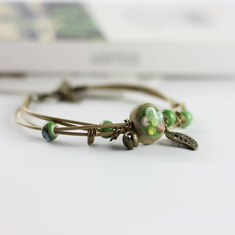 Title 4, Pulseira de cerâmica artesanal com flor de lótu...