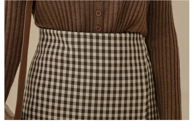 Title 1, Ladies mid-length plaid skirt offers timeless s...
