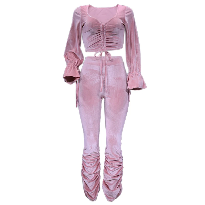 Conjunto de duas peças feminino, top de manga longa com recorte na cintura. Ideal para um visual moderno e estiloso, perfeito para diversas ocasiões. — foto 1