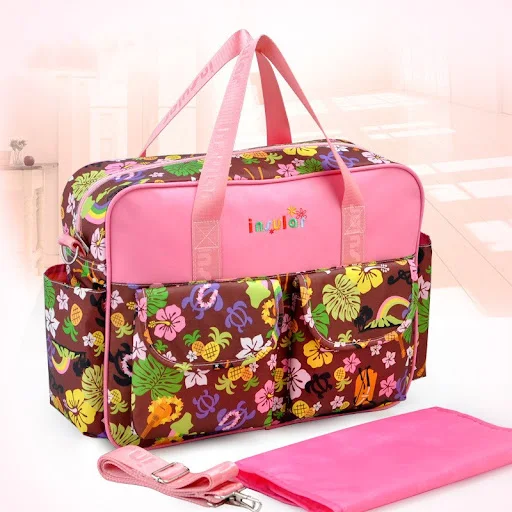 Title 4, Crossbody mommy bag for on-the-go parents. Spac...