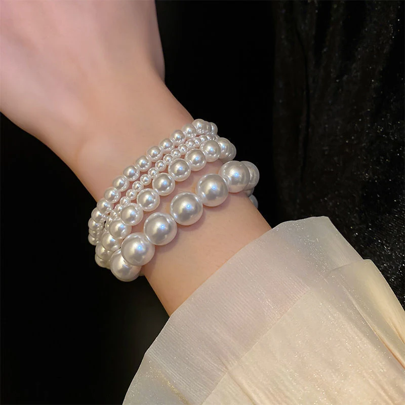 Pulseira elástica de pérolas retrô francesa simples, um acessório charmoso e versátil para adicionar um toque de sofisticação ao seu visual. — foto 10