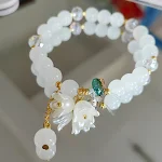 Bracciale da donna Lily Crystal Flowers bicolore crema, un accessorio elegante per un tocco floreale e scintillante al tuo look. — foto 12