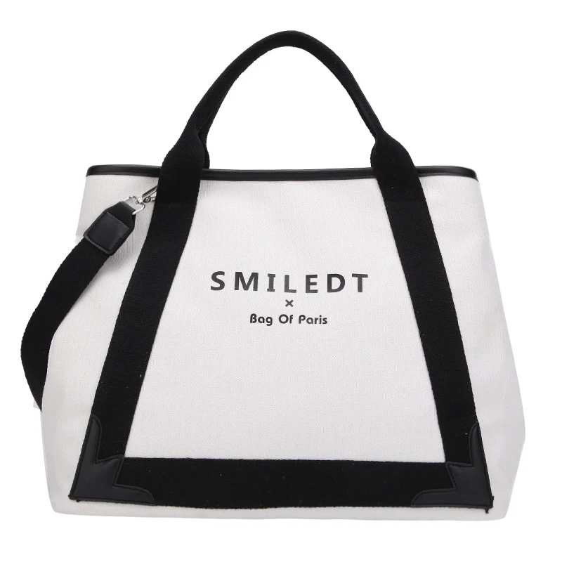 Eenvoudige canvas handtas met grote capaciteit, perfect voor dames die veel spullen willen meenemen in stijl en comfort. — foto 2