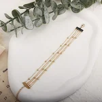 Pulseira de joia romântica com design de coração pentagrama dourado e grão contrastante, perfeita para um toque especial e elegante. — foto 11