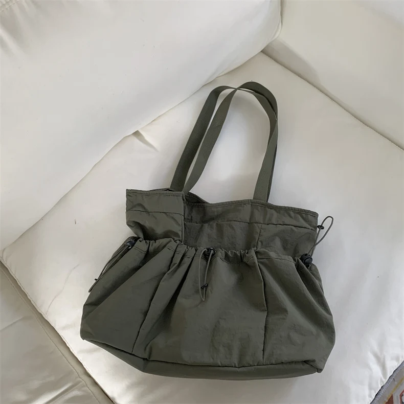 Bolsa de mão de lona com cordão e grande capacidade para uso diário. Perfeita para trabalho, faculdade ou passeios. Leve tudo o que precisa. — foto 7
