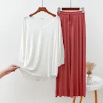 White with brick red pants