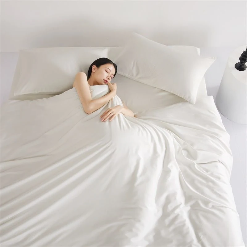 White Cotton Four-Piece Comforter Bed Set. Experience ultimate comfort and a restful night's sleep with this soft and st — photo 1