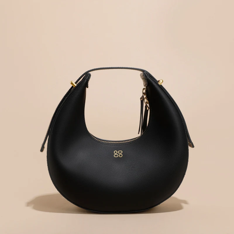 Bolsa feminina de moda com design de nicho semicircular. Um acessório elegante e moderno para mulheres que buscam estilo e sofisticação. — foto 4