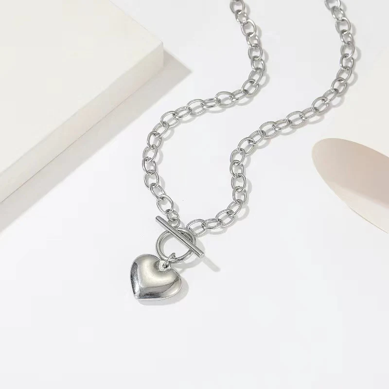 Conjunto feminino de colar e pulseira com pingente de coração em formato de O, perfeito para mulheres que buscam elegância e sofisticação. — foto 1