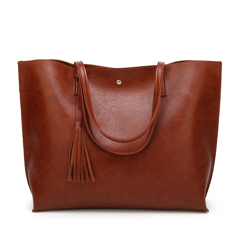 Bolsa feminina de ombro com tassel, grande capacidade, perfeita para carregar tudo que você precisa com elegância e praticidade. — foto 4