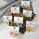 Brincos de argola grandes e exagerados, para um visual marcante. Adicione estilo e ousadia ao seu look com estes brincos incríveis. — foto 10