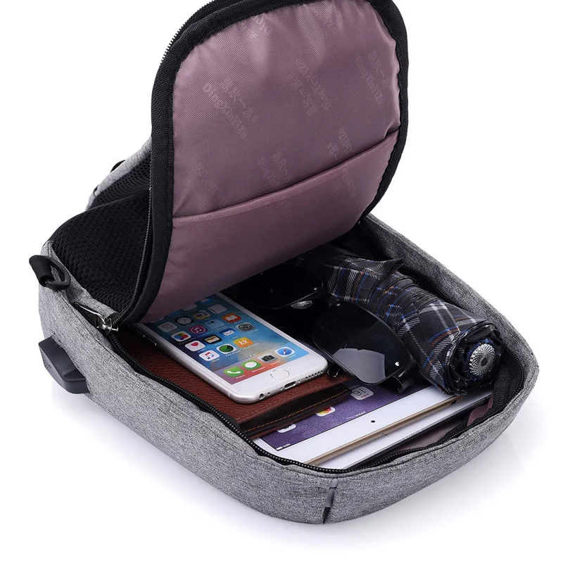 Mochila diagonal USB impermeável multicamadas. Mantenha seus eletrônicos seguros e organize tudo com esta bolsa perfeita para viagens e uso diário. — foto 8
