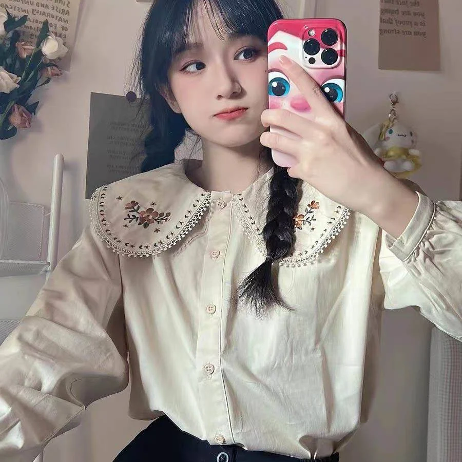Camisa de manga larga para mujer con cuello de muñeca ideal para un look elegante y versátil, perfecta para el trabajo o una salida casual. — foto 4