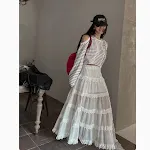 Saia de malha ligeiramente transparente com cintura alta, costura de renda e efeito emagrecedor, ideal para um look elegante. — foto 1