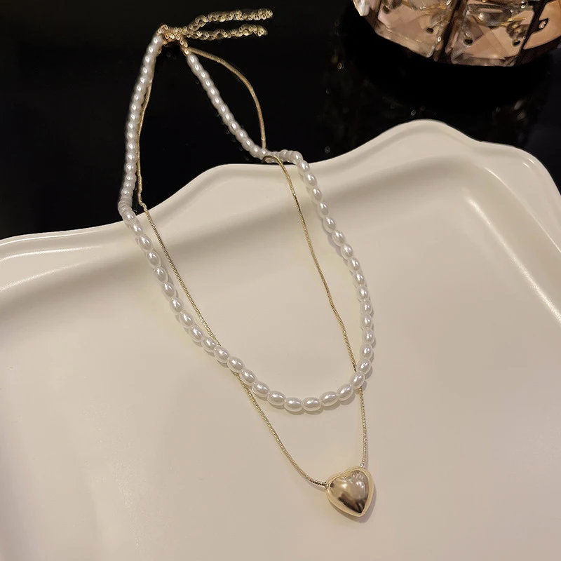 Colar feminino de pérolas com costura e amor, perfeito para combinar com tudo. Adicione elegância e charme a qualquer look, ideal para diversas ocasiões. — foto 24
