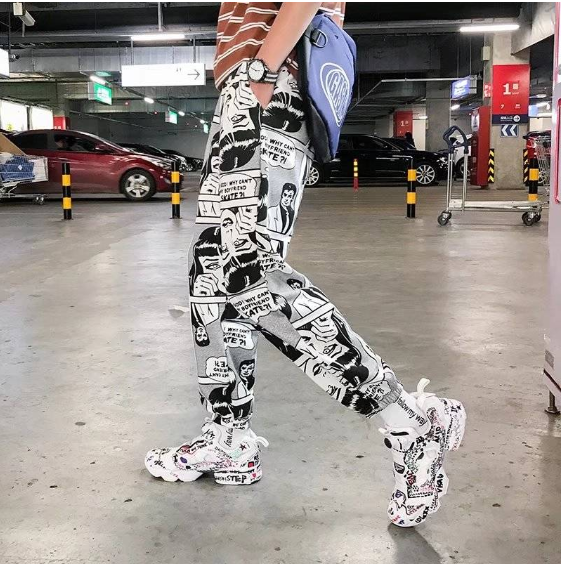 Tide brand hip hop newspaper pants men and women pants ins the same paragraph street loose beam pants national tide — photo 1