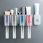 Four cupsand toothpaste squeez