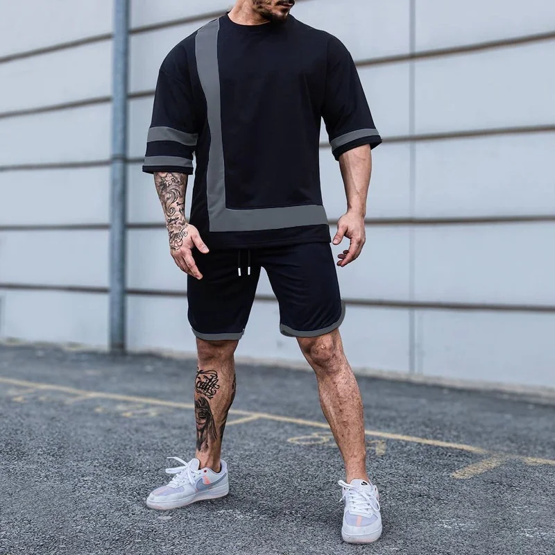 Conjunto masculino com gola careca e blocos de cores, manga curta e shorts, perfeito para o verão, leve e estiloso. — foto 1