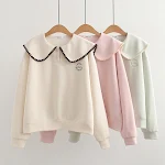 Top versátil e jovial com gola boneca estilo Western e corte solto, perfeito para um visual descontraído e cheio de estilo. — foto 2